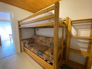 a bedroom with two bunk beds in a room at Boost Your Immo Les Deux Alpes 174 / Le Midi in Les Deux Alpes