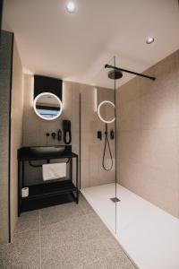 a bathroom with a shower with a glass door at ibis Styles ST Pauls Bay Malta in St Paul's Bay