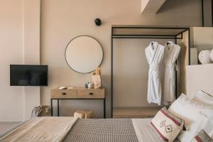 A bed or beds in a room at Votsalo Suite-Grand Blue Beach Residence