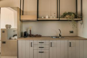 A kitchen or kitchenette at Votsalo Suite-Grand Blue Beach Residence