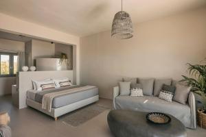 A bed or beds in a room at Votsalo Suite-Grand Blue Beach Residence