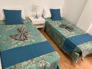 Posteľ alebo postele v izbe v ubytovaní MARTSARAs PLAYA SARDINA