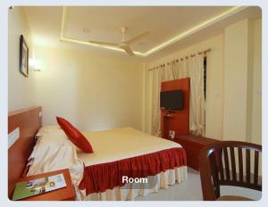 Televisyen dan/atau pusat hiburan di Hotel Sasthapuri