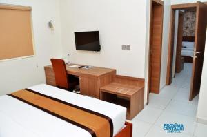 A television and/or entertainment centre at Proxima Centauri Hotel