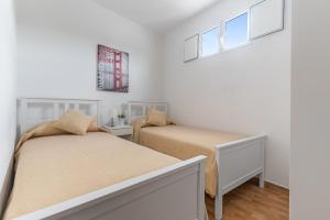 Posteľ alebo postele v izbe v ubytovaní Home2Book Charming Attic Arucas Center, Terrace