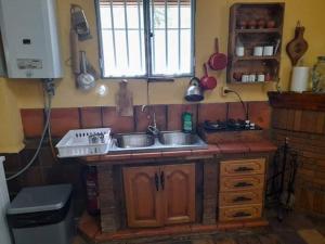 a kitchen with a sink and a counter top at R U Ready Fishing, River Ebro in Mequinenza