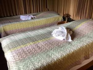 Een bed of bedden in een kamer bij Nantawanhomestay