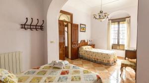 Posteľ alebo postele v izbe v ubytovaní La Casa de Isabel Villaviciosa de Córdoba by Ruralidays + 18 fotografií