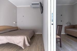 Postel nebo postele na pokoji v ubytování Hotel Susy