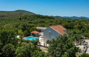 an aerial view of a house with a swimming pool at Villa Doli - Lovely holiday home with private pool in Doli