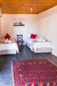 Postel nebo postele na pokoji v ubytování Witfontein Game Lodge