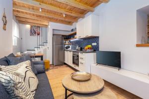 a living room with a couch and a table at Nona´s Dorf Haus in Liapades in Liapades