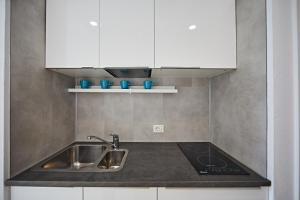 Kuchyň nebo kuchyňský kout v ubytování Ocean View Apartment