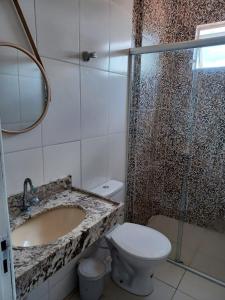 Ένα μπάνιο στο Apartamento em Camboinha