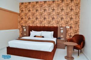 A bed or beds in a room at Proxima Centauri Hotel