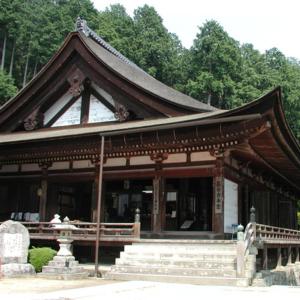 a building with a roof and stairs in a park at Kyukamura Ohmi-Hachiman in Omihachiman