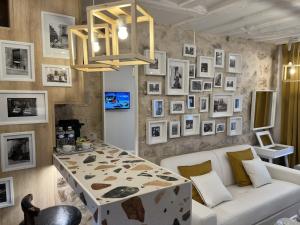 a living room with a white couch and a table at Villette & Canal - Apartment in Paris