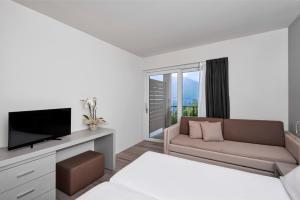 TV a/nebo společenská místnost v ubytování Hotel Royal Village