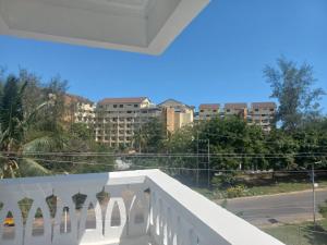 a balcony with a view of the city at Maranda Deluxe Double Seaview room - B&B with pool. in Ukunda