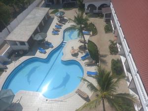 an overhead view of a swimming pool at a resort at Maranda Deluxe Double Seaview room - B&B with pool. in Ukunda