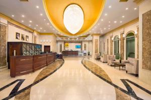 a large lobby with a large ceiling with a large ball at Wyndham Garden Dammam in Dammam