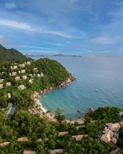 an aerial view of a beach with houses and the ocean at Banyan Tree Samui in Lamai