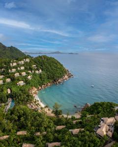 an aerial view of a beach with houses and the ocean at Banyan Tree Samui - SHA Extra Plus in Lamai