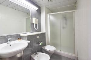 a bathroom with a sink, toilet, and bathtub at CDSHotels Terrasini - Città del Mare in Terrasini