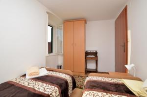 Postel nebo postele na pokoji v ubytování Apartment Stari Grad