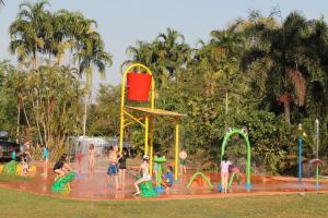 a group of people playing in a water park at BIG4 Howard Springs Holiday Park in Darwin