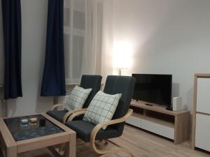 TV a/nebo společenská místnost v ubytování Apartament Rydygiera