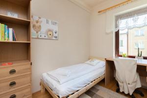 Łóżko lub łóżka w pokoju w obiekcie Gdynia Centrum Wyjątkowy Apartament przy Promenadzie z Balkonem by Noclegi Renters