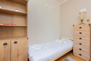 Łóżko lub łóżka w pokoju w obiekcie Gdynia Centrum Wyjątkowy Apartament przy Promenadzie z Balkonem by Noclegi Renters