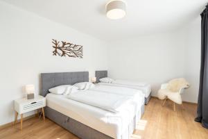 A bed or beds in a room at Apartmány Oravskie