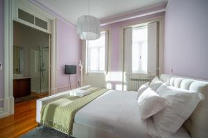 Säng eller sängar i ett rum på Oporto Near Boavista