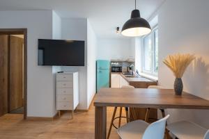 A kitchen or kitchenette at Apartmány Oravskie