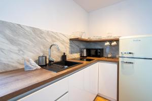 A kitchen or kitchenette at Apartmány Oravskie