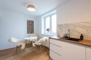 A kitchen or kitchenette at Apartmány Oravskie