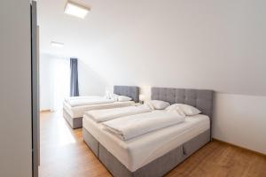 A bed or beds in a room at Apartmány Oravskie
