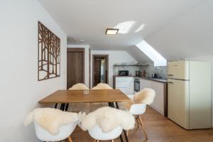 A kitchen or kitchenette at Apartmány Oravskie