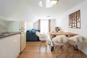 A kitchen or kitchenette at Apartmány Oravskie