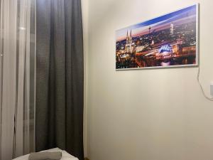 Łóżko lub łóżka w pokoju w obiekcie Apartamenty Mikubo Wrocław