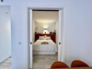 Łóżko lub łóżka w pokoju w obiekcie 797 Holiday Rentals- Apartamento en Sunset frente al mar