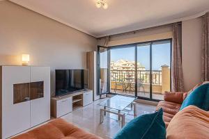 Televízia a/alebo spoločenská miestnosť v ubytovaní 797 HOLIDAY RENTALS - Moderno Piso para 5 con hermosas vistas