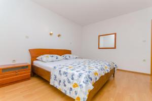 Postel nebo postele na pokoji v ubytování Apartments Milivoj