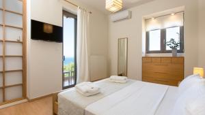 Posteľ alebo postele v izbe v ubytovaní Villa Naya