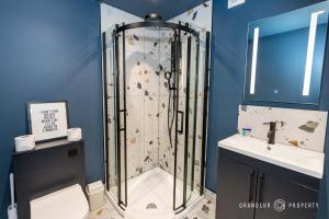 a shower stall in a bathroom with a sink at New & Unique 1bed, near Bournemouth Beach and Town Centre - Beachy Keen in Bournemouth