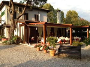 a house with a bench in front of it at Park Hotel Elefante in Verona