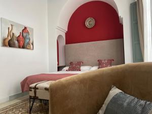 Postel nebo postele na pokoji v ubytování La Gitanilla Alojamiento & Encanto Jerez