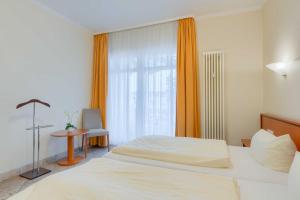 Ein Bett oder Betten in einem Zimmer der Unterkunft Villa Seestern Whg. 760